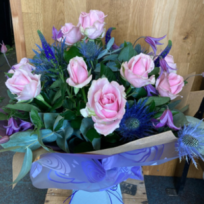 Amazing Florence - This country style hand tied bouquet includes roses, clematis, eryngium and Veronica.