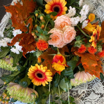 Autumn bouquet  - A mixture of roses, carthamus, bloom chrysanthemums, and autumn leaves.