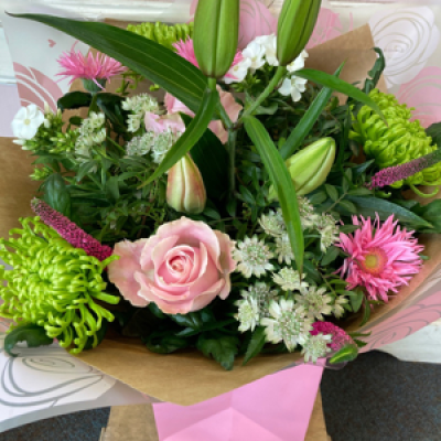 Molly - Lilies, roses, bloom chrysanthemums and phlox make this a beautiful hand tied for any occasion.