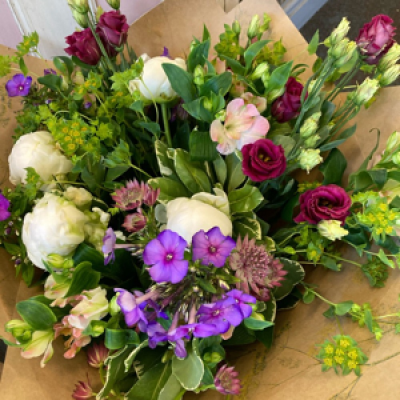 Cottage garden - Pretty mix of phlox, peonies, Lizianthus, astrantia,and foliage. Wrapped in paper with raffia bow.