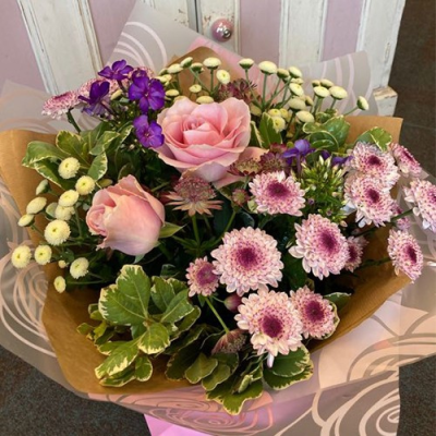 Fairy's Garden - An lovely handtied in water presented in a gift box. Includes pink, purple and white flowers with complimentary foliage. Hand delivered with care in and around Dereham by Bright and Beautiful.