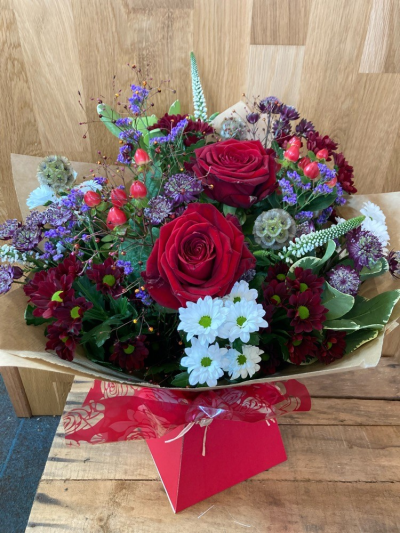 Just because - Country mix of roses, veronica, statice santini and hypericum berries.