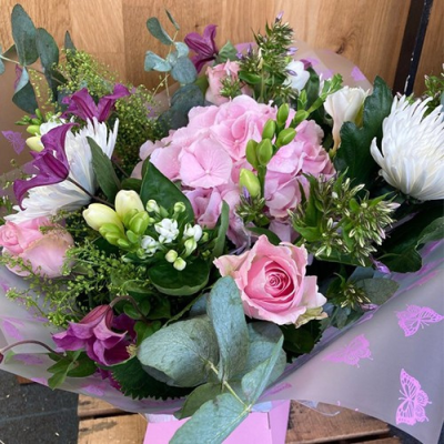Sweet As Pie - An lovely handtied in water presented in a gift box. Includes pink, purple and white flowers with complimentary foliage. Hand delivered with care in and around Dereham by Bright and Beautiful.